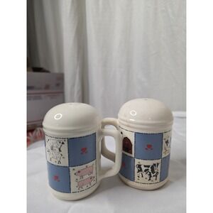 Checkerboard Farms ceramic salt and pepper shakers featuring a blue and white...